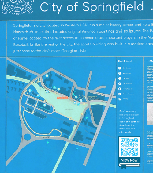 Una targa in una città con un QR Code che contiene una guida della città da scaricare in formato pdf.